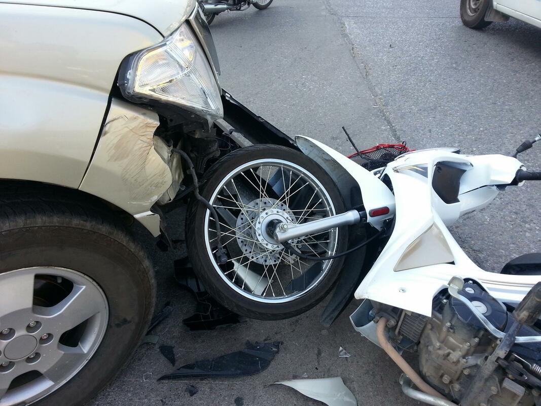 a motorcyle in a car crash