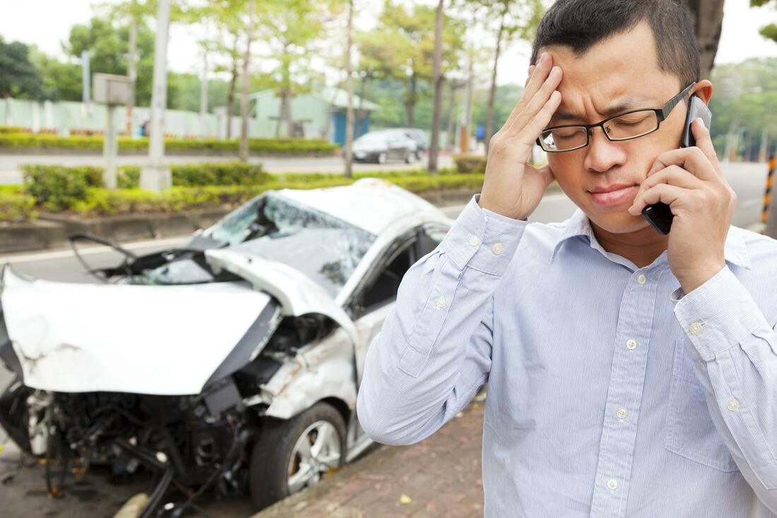 A man who is worrying about a car accident